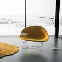 Contemporary fireside chair / fabric / leather...