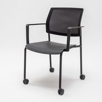 Upholstered conference chair / with armrests...