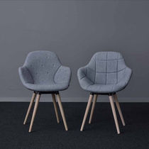 Upholstered conference chair / with armrests...