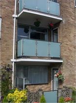balcony with sandblasted glass panels  New Forest Metal Work