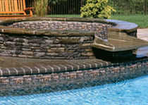 circular built-in hot-tub CUSTOM BUILT IN SPILLOVER SPA LEGACY EDITION POOLS