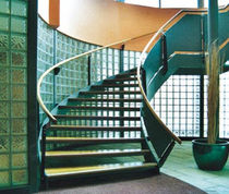 circular staircase with a lateral stringer for commercial buildings (metal frame and wooden steps) DAVID LLOYD CLUB FIRE ESCAPES