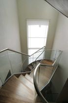 circular staircase with a lateral stringer (metal frame and wooden steps) CLARENDON ROAD SS 613 SPIRAL Stairs