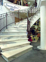 circular staircase with a lateral stringer (metal frame and marble steps)  S&ouml;lker Marmor