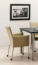 contemporary bridge armchair with casters  Unic Design