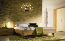contemporary double bed with headboard upholstered in leather FLAVO h&uuml;lsta