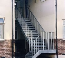 exterior quarter-turn staircase (metal frame and steps)  Crescent Stairs