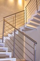 half-turn staircase with a lateral stringer MODEL 500 Interbau