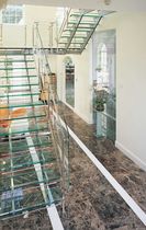 half-turn staircase with a lateral stringer (metal frame and glass steps) WENTWORTH ESTATE SS 513 SPIRAL Stairs
