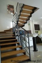 half-turn staircase with a lateral stringer (metal frame and wooden steps) ELCR-CAM la stylique