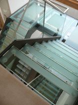 half-turn staircase with a lateral stringer for commercial buildings (metal frame and glass steps) HENLEY SAXUM