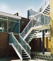 half-turn staircase with a lateral stringer for commercial buildings (metal frame and steps) KINGS HOUSE SCHOOL FIRE ESCAPES