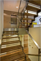half-turn staircase with a lateral stringer (metal frame and wooden steps)  Canal Engineering Ltd