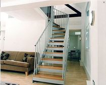 quarter-turn staircase with a lateral stringer (metal frame and wood steps)  Crescent Stairs