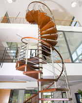 spiral staircase for commercial buildings (metal frame and wooden steps)  Kevala Stairs Limited