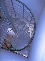 spiral staircase (metal frame and metal grid step) ATRIUM SYSTEM PERFO Atrium