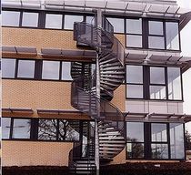 spiral staircase with a lateral stringer for commercial buildings (metal frame and steps) FULBOURN Crescent Stairs