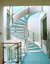 spiral staircase with a lateral stringer (metal frame and glass steps)  Crescent Stairs