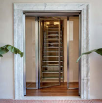 steel swing door with glass panel by Andrea Guidi Di Bagno ESSEMME