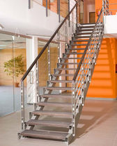 straight staircase with a lateral stringer for commercial buildings (metal frame and wooden steps)  Kevala Stairs Limited