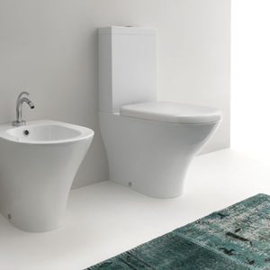 free-standing WC / monobloc / ceramic / with flush button