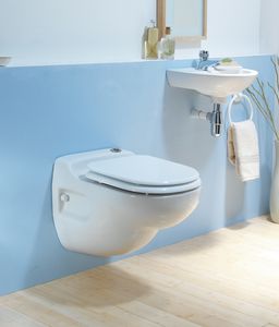 wall-hung toilet / ceramic / with macerator
