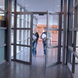 swing door / metal / automatic / for hotels