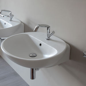 countertop washbasin / oval / ceramic / contemporary