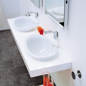 built-in washbasin / oval / ceramic / contemporary