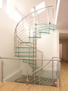 spiral staircase / glass steps / metal frame / without risers