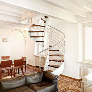 spiral staircase / metal frame / wooden steps / lateral stringer