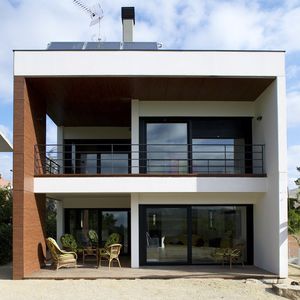 prefab house / contemporary / concrete / energy-efficient
