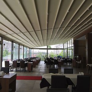 wall-mounted pergola / metal / with sliding canopy / commercial