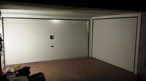 sectional garage doors / metal / polyurethane foam / automatic