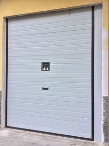 sectional garage doors / metal / polyurethane foam / automatic