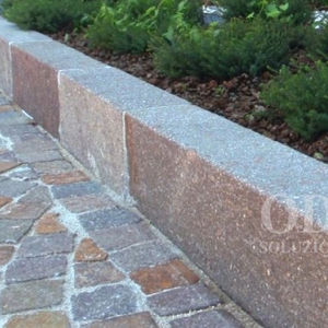 sidewalk edge / street gutter / linear / porphyry