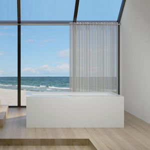 free-standing bathtub / Corian® / hydromassage / chromotherapy