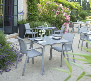 contemporary armchair / Textilene® / fiberglass / resin