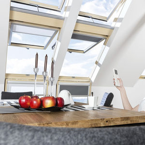 pivoting roof window / wooden / double-glazed / electric
