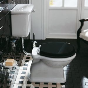 free-standing WC / ceramic / with lever / with high tank