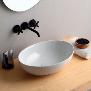 countertop washbasin / oval / ceramic / contemporary