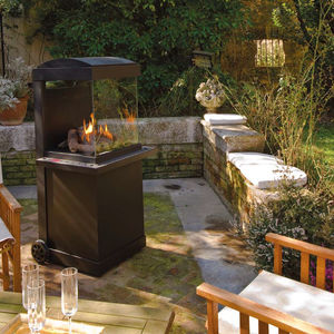 wood fireplace / contemporary / closed hearth / free-standing
