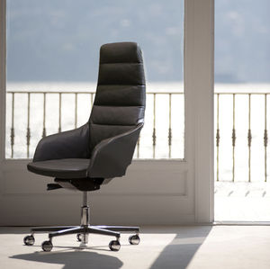 contemporary executive chair / leather / fabric / on casters
