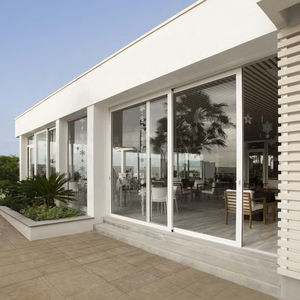 tilt-and-slide patio door / aluminum / quadruple-glazed / thermal break