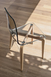 contemporary chair / wooden / polycarbonate / transparent