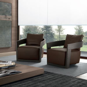 contemporary armchair / leather / solid wood / fabric