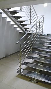 half-turn staircase / stainless steel steps / metal frame / without risers
