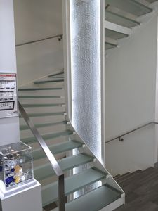 half-turn staircase / steel frame / glass steps / lateral stringer