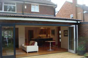 sliding patio door / sliding and stacking / wooden / double-glazed