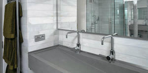 wall-mounted washbasin / oval / natural stone / contemporary